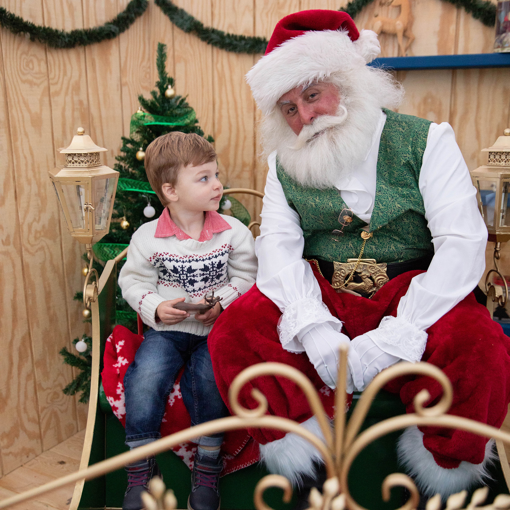 Child with Santa in sleigh