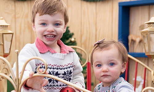 Two children having fun in the sleigh