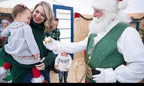 Santa giving an ornament